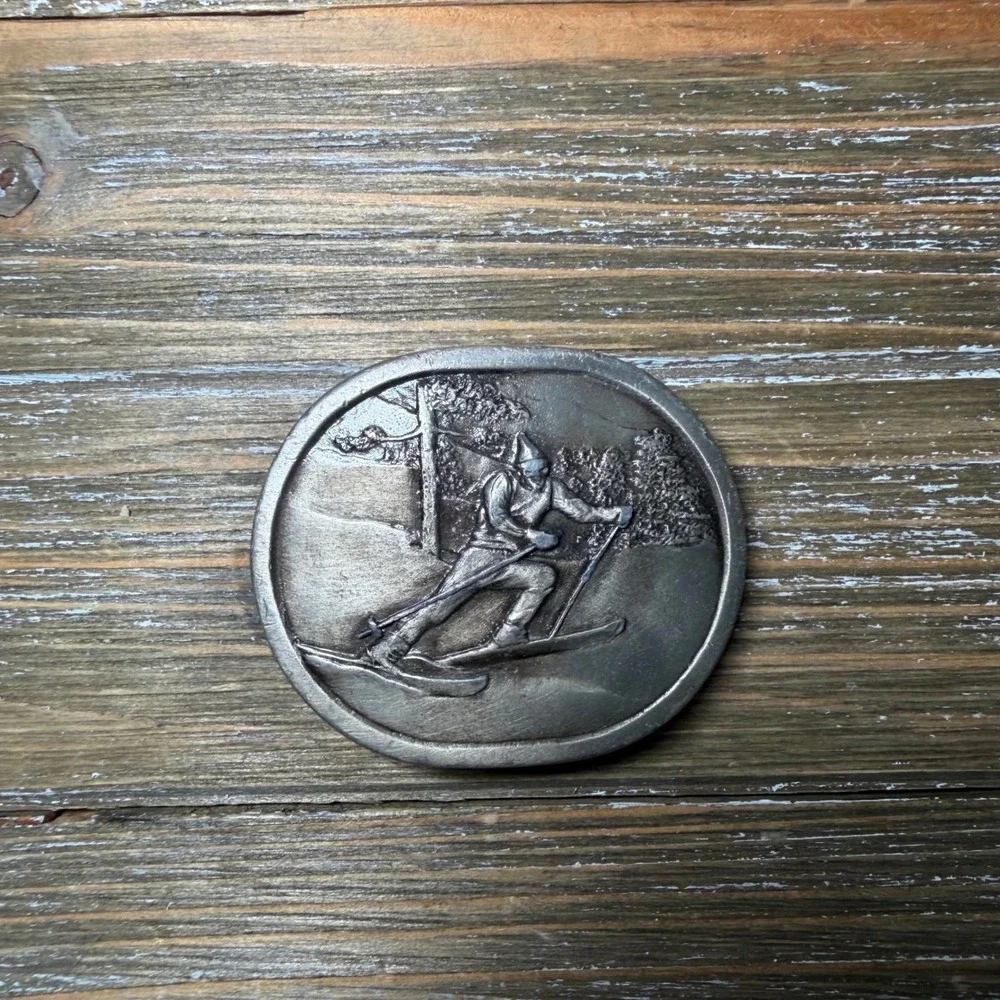 Vintage 1977 Indiana Metal Craft Alpine Skier Belt Buckle Silver Tone Oval 70s